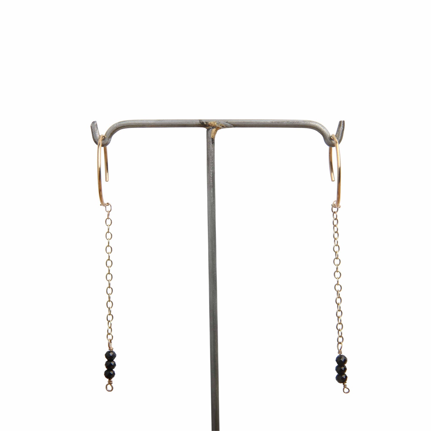 gold hoop earrings with gold chain and black spinel gemstones - white background