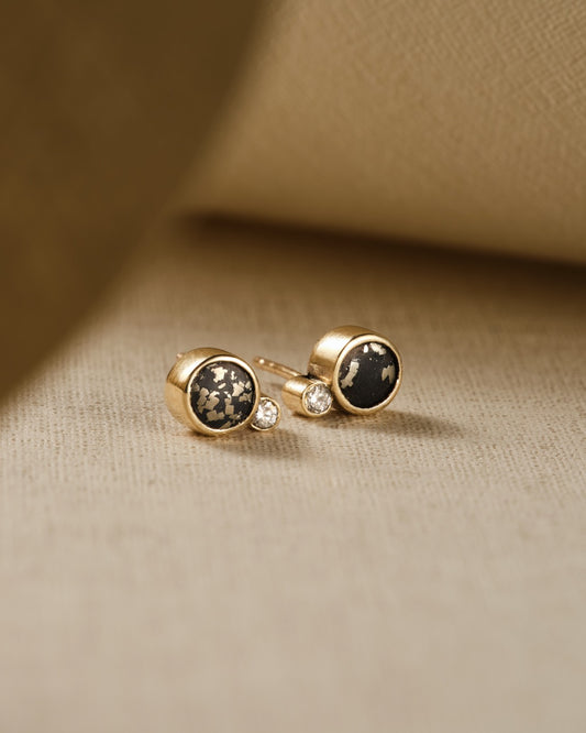 stellar black and gold stud earrings with diamond and slate pyrite
