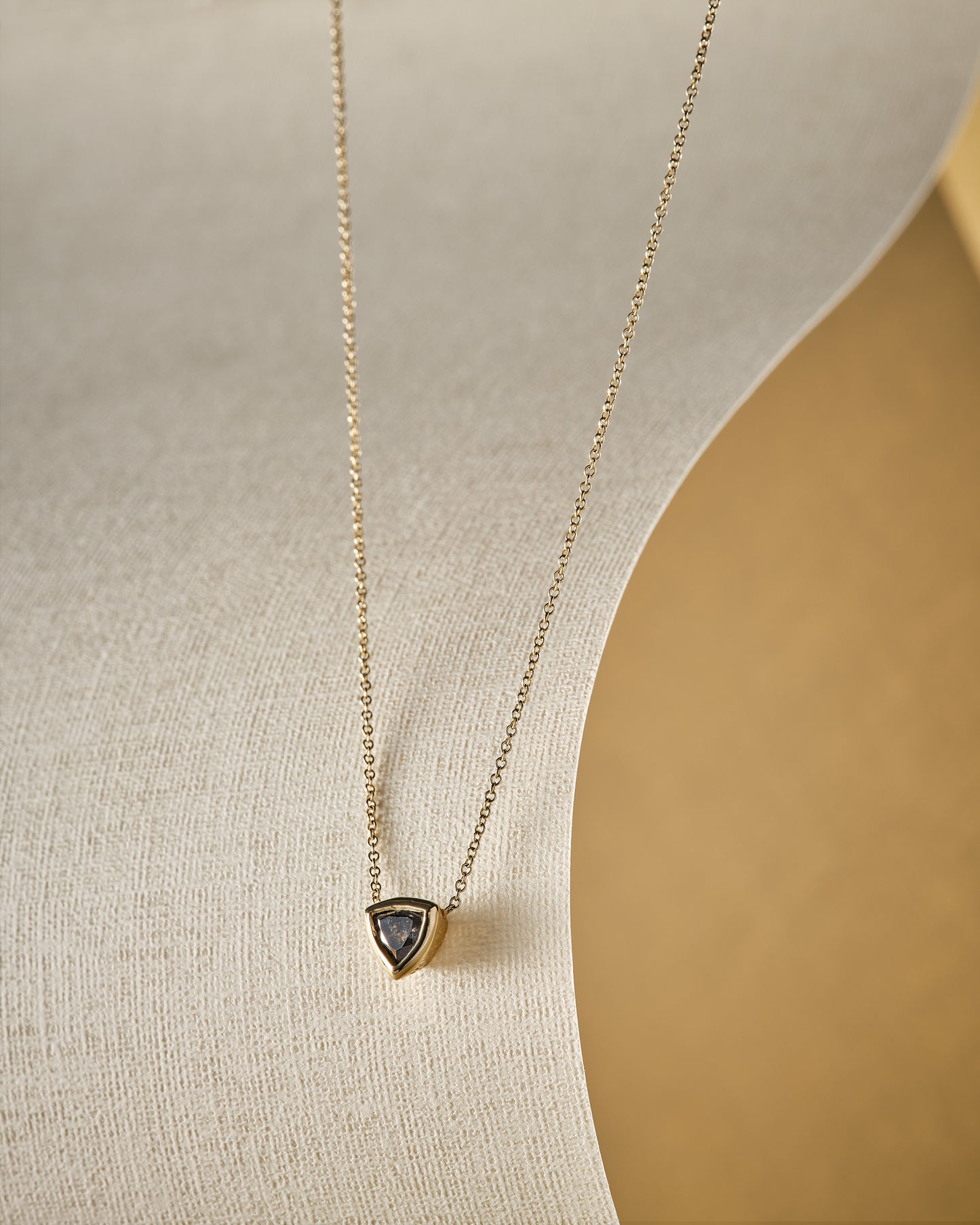 salt and pepper diamond and gold necklace lifestyle