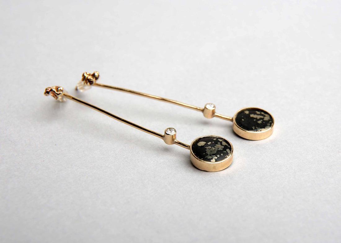 stellar black and gold drop earrings