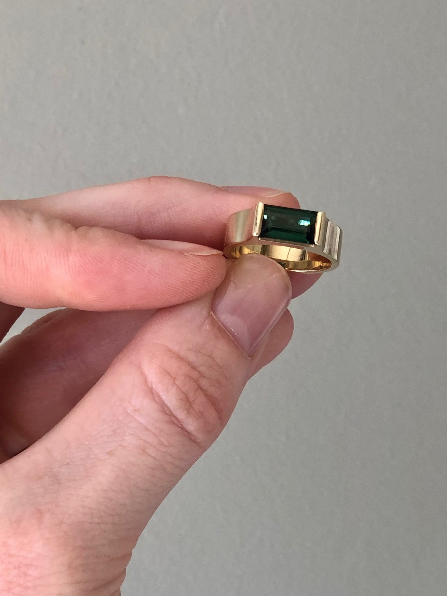 tourmaline baguette gold ring with hand