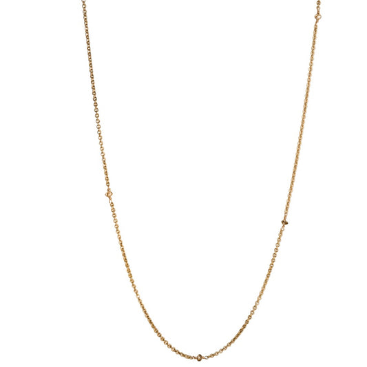 Gold chain necklace with diamond beads on a white background