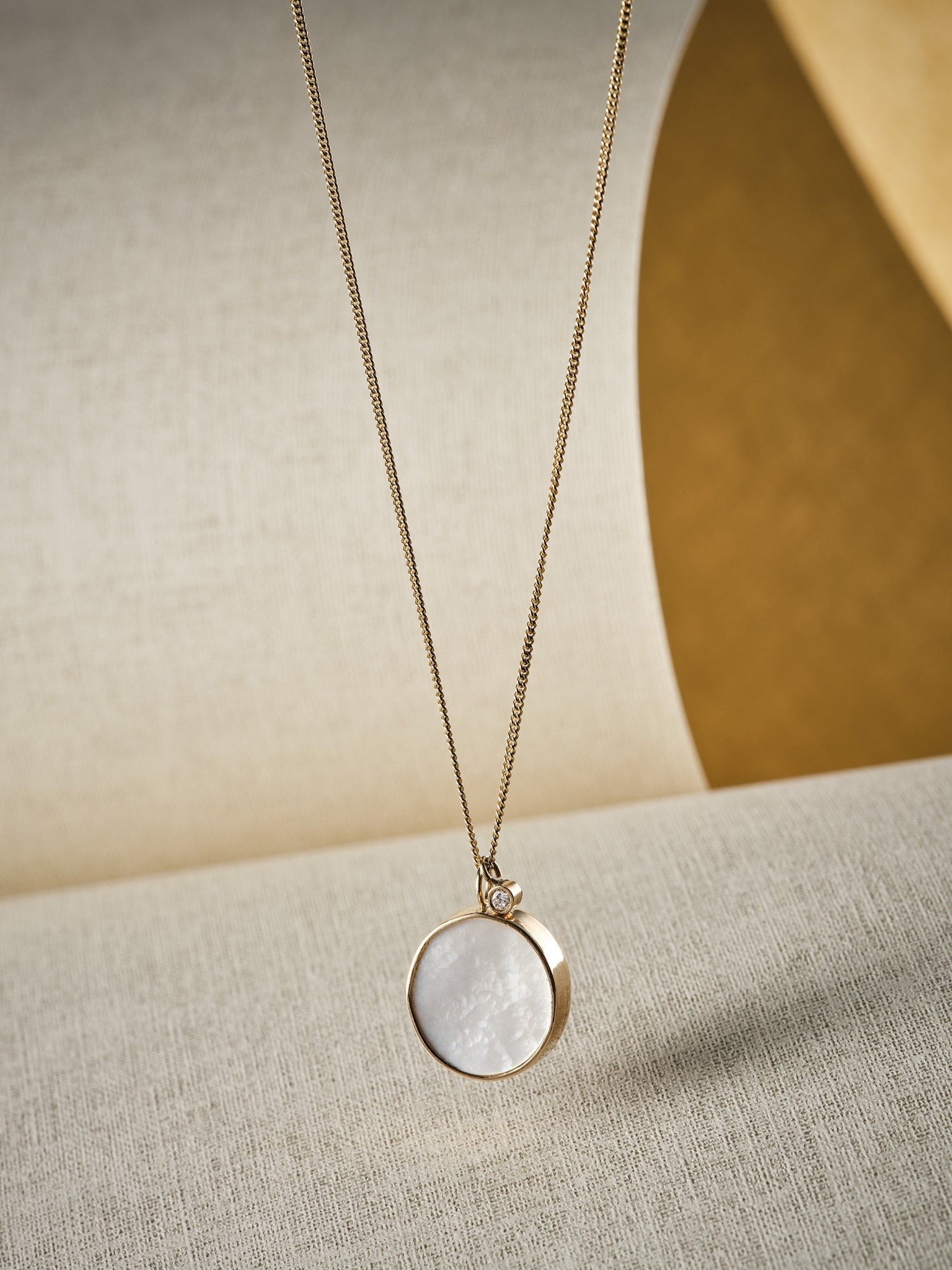 mother of pearl and gold pendant necklace lifestyle