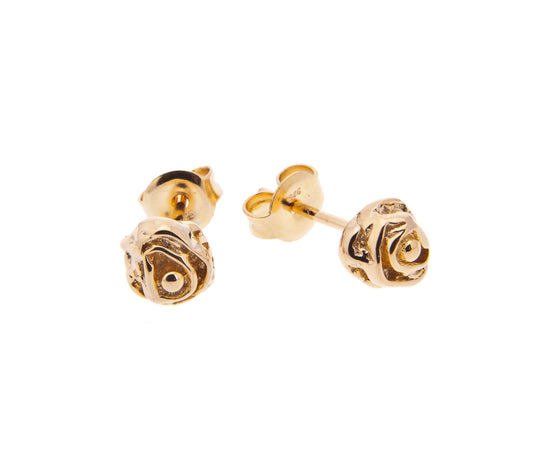 rose gold earring studs on white background