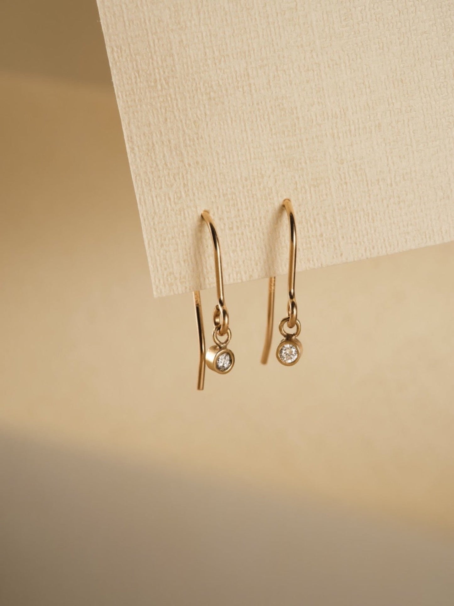 diamond and gold hook drop earrings