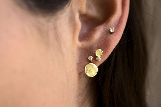 handmade esme disc gold studs with diamonds white background on model
