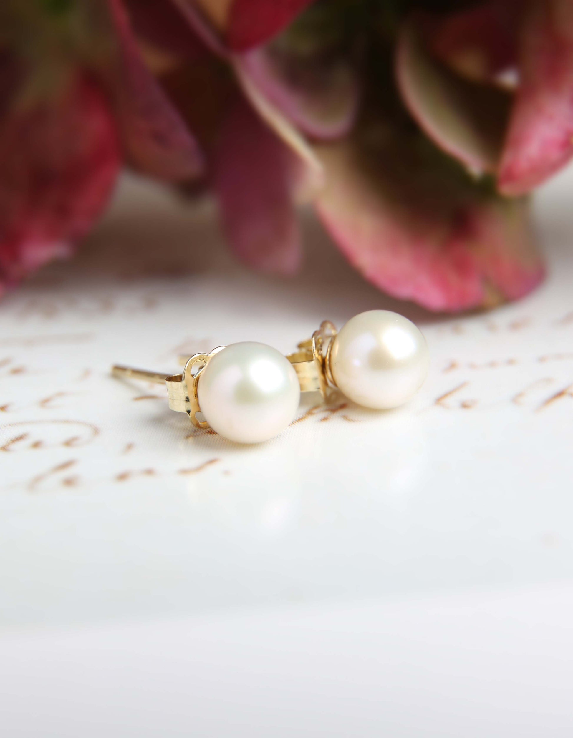 white pearl studs with flowers - lifestyle pic