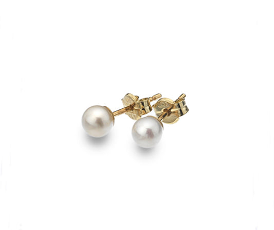 white pearl studs on white background