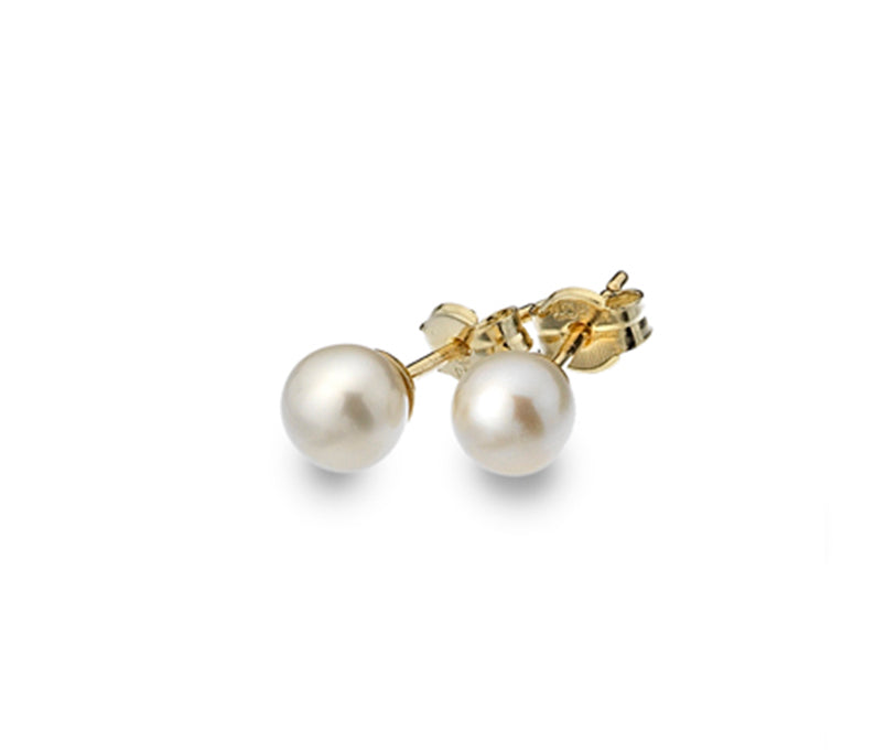 white pearl earring studs at angle